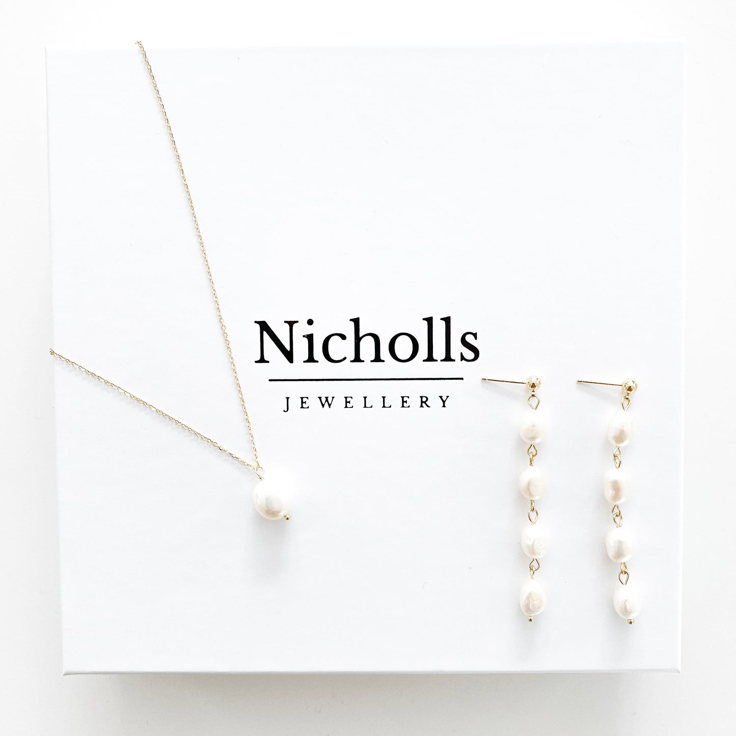 Delicate Pearl necklace and earring set in gold