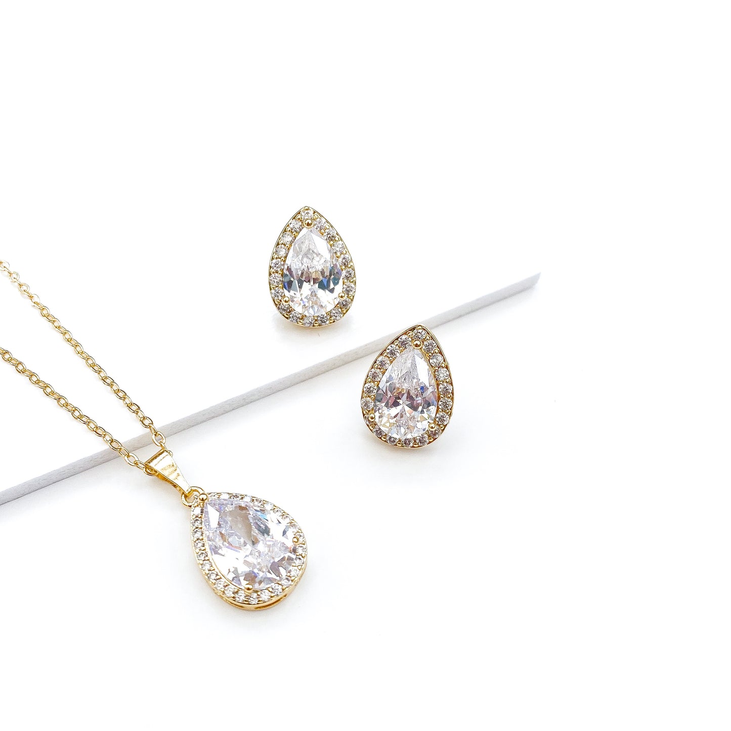 Trust Crystal Teardrop Gold Studs